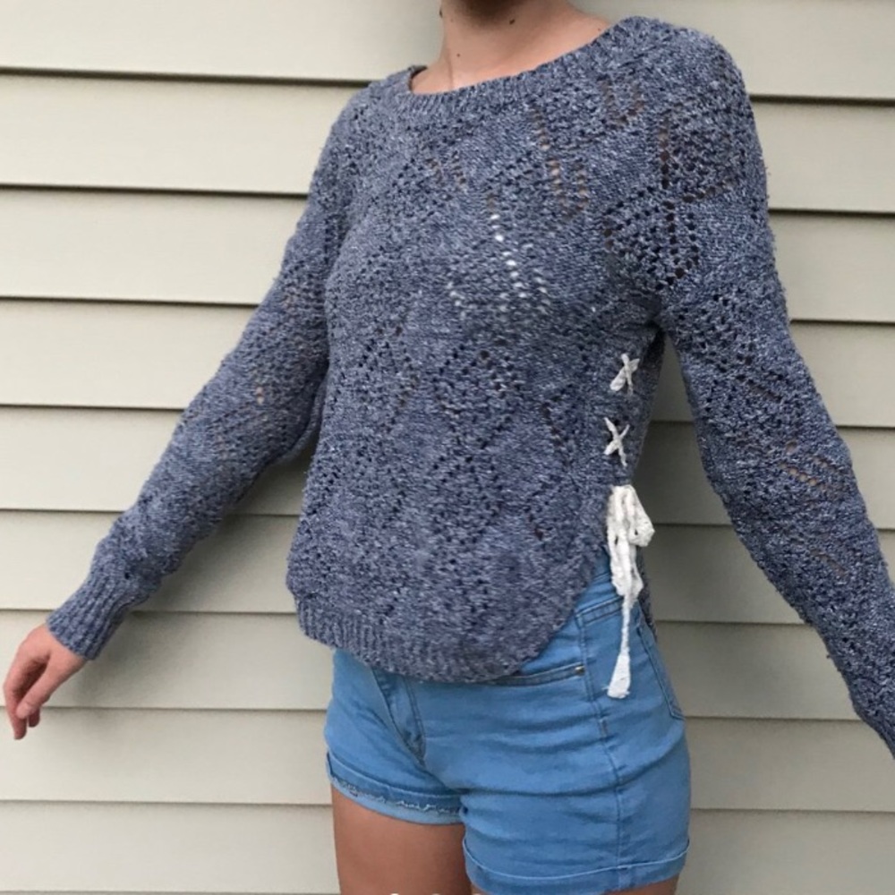blue knit sweater with laced up sides